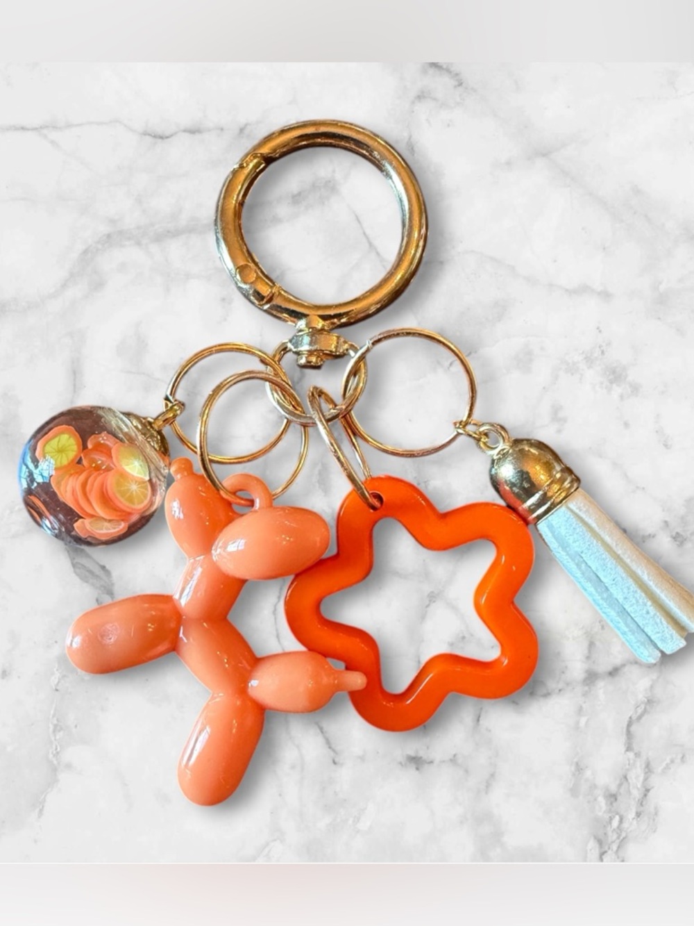 Orange Balloon Dog Keychain with Star Charm